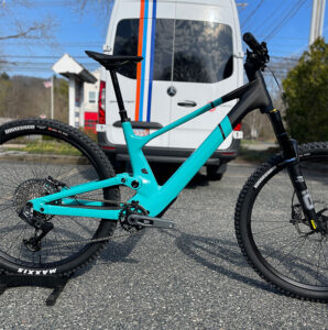 Teal SCOTT Genius parked in front of the STBG van