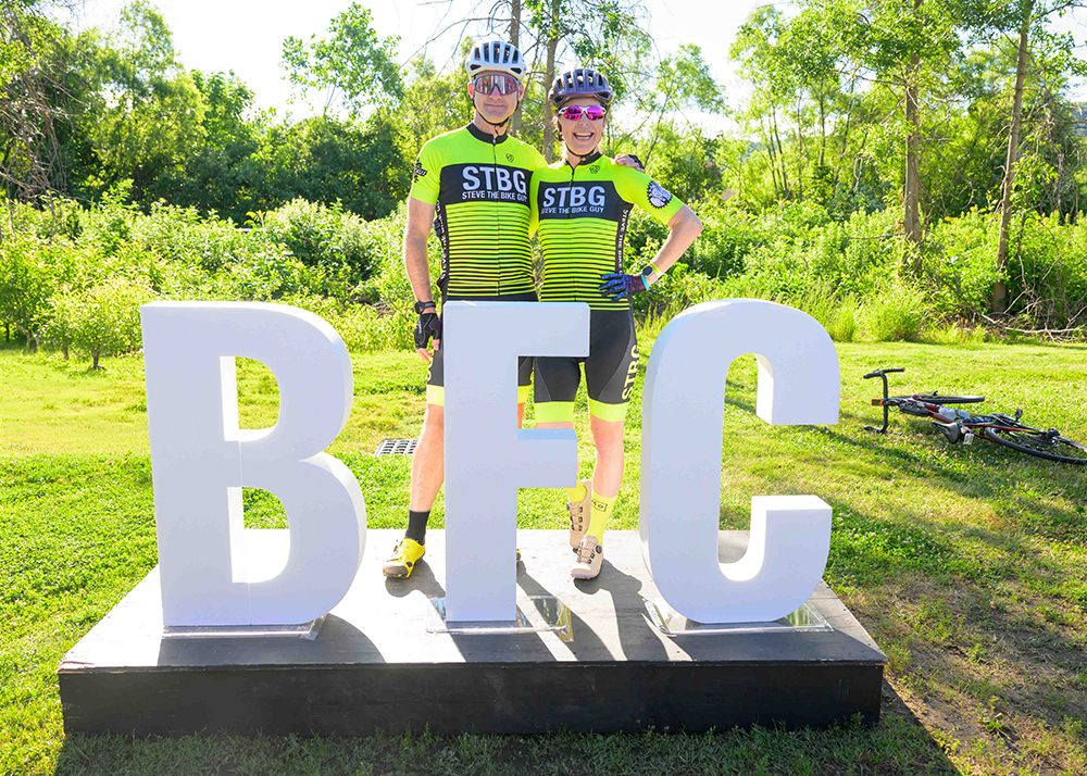 Steve and Kristin standing behind BFC cut letters.
